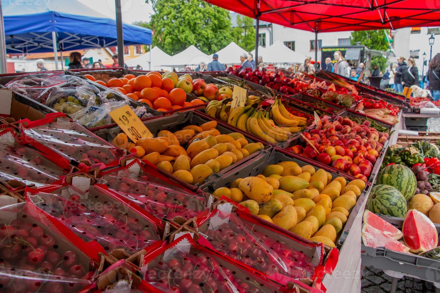 A fruit stand with many different types of fruit photo