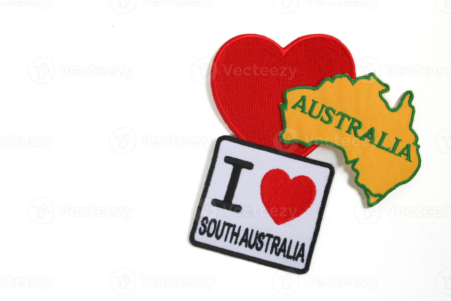 Stitched textile art of I LOVE South Australia with heart and country outline on white background. Positioned right for copy space on left. Ideal for travel or concept designs. photo