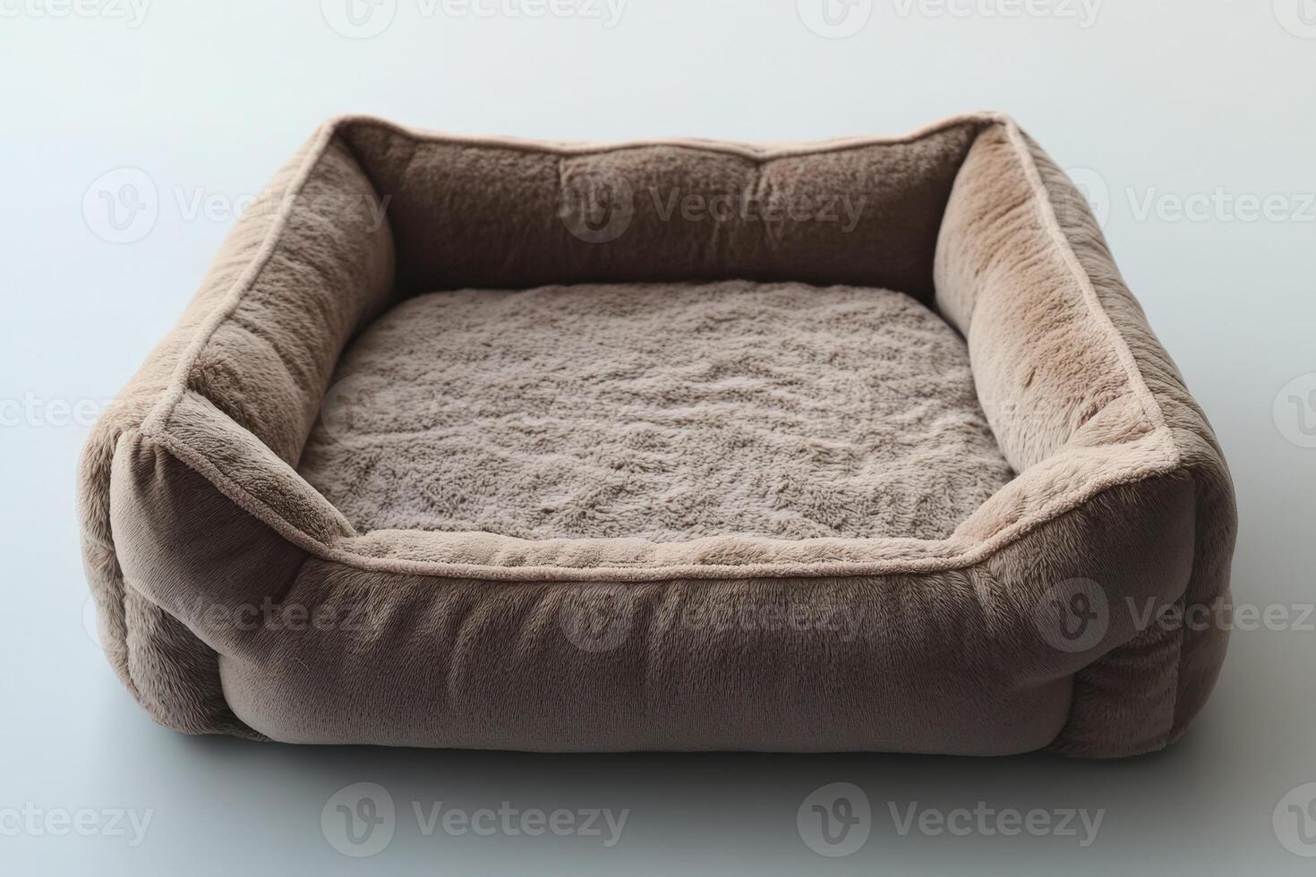 A small dog bed on a white surface photo