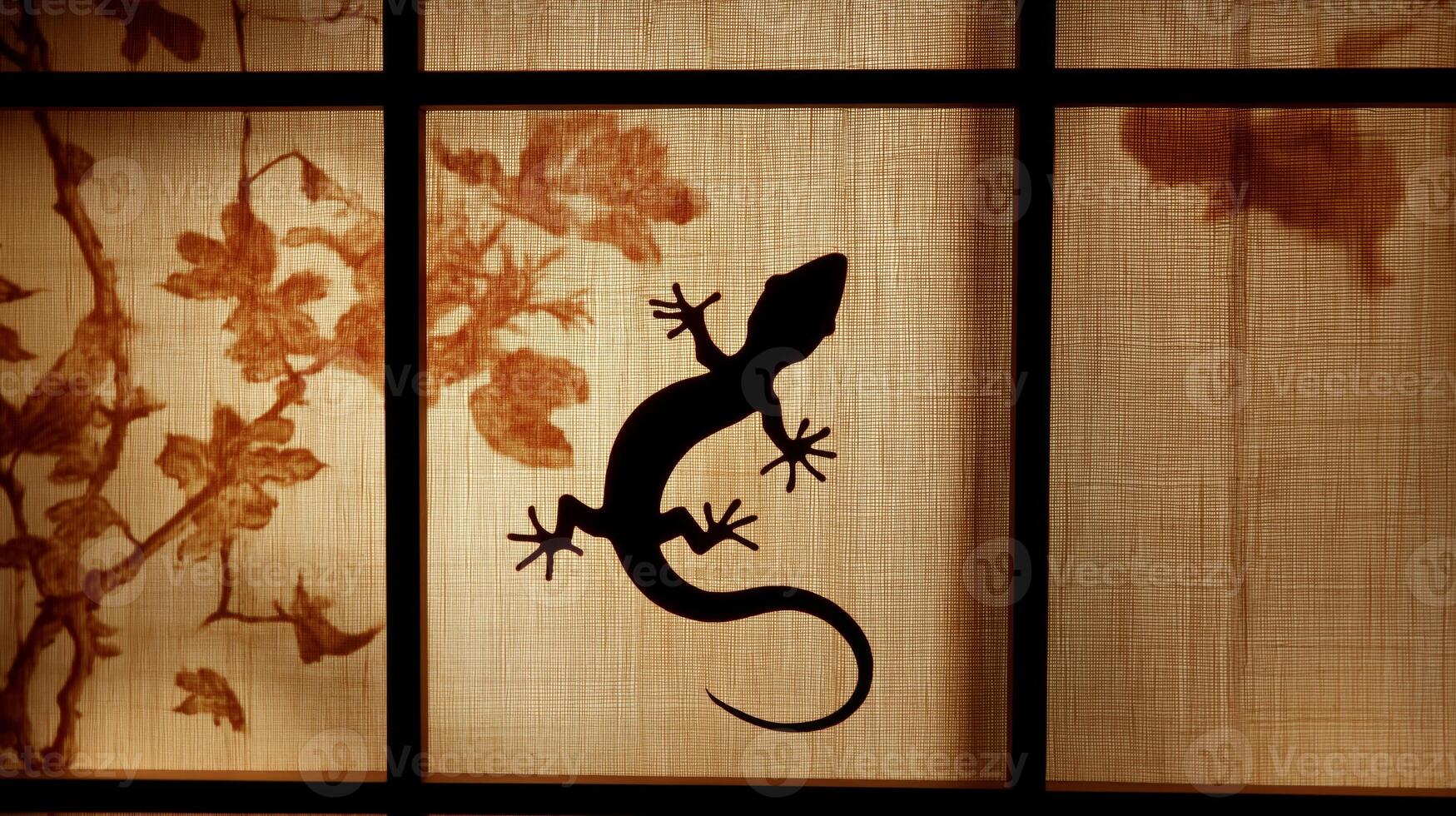 A lizard moves on a tapestry, casting a striking silhouette in the soft evening light. photo