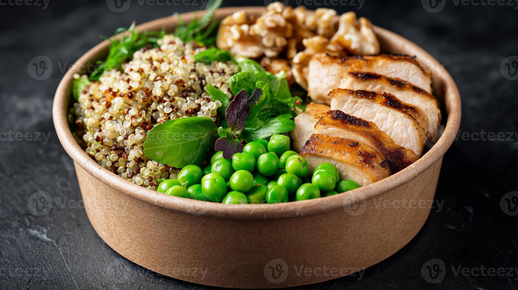 A healthy bowl featuring grilled chicken, quinoa, peas, and walnuts arranged appetizingly. photo