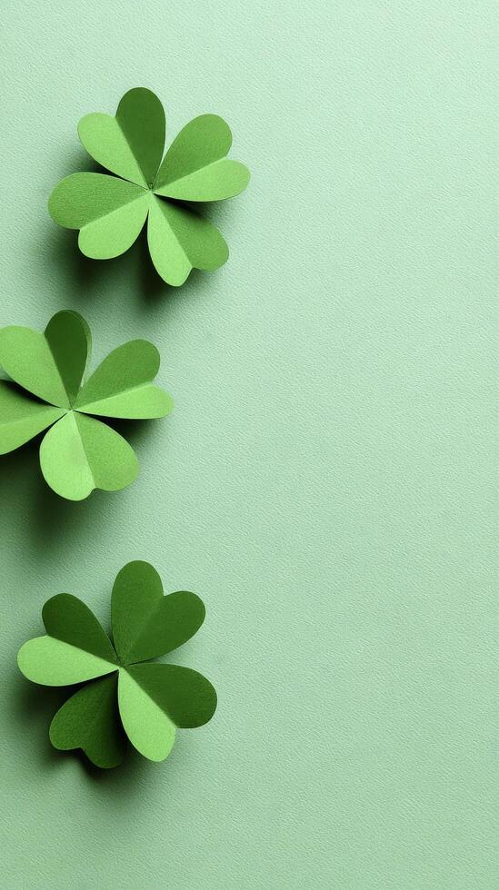 Green Paper Clovers Arranged on a Light Green Background for Spring Decoration Ideas. photo