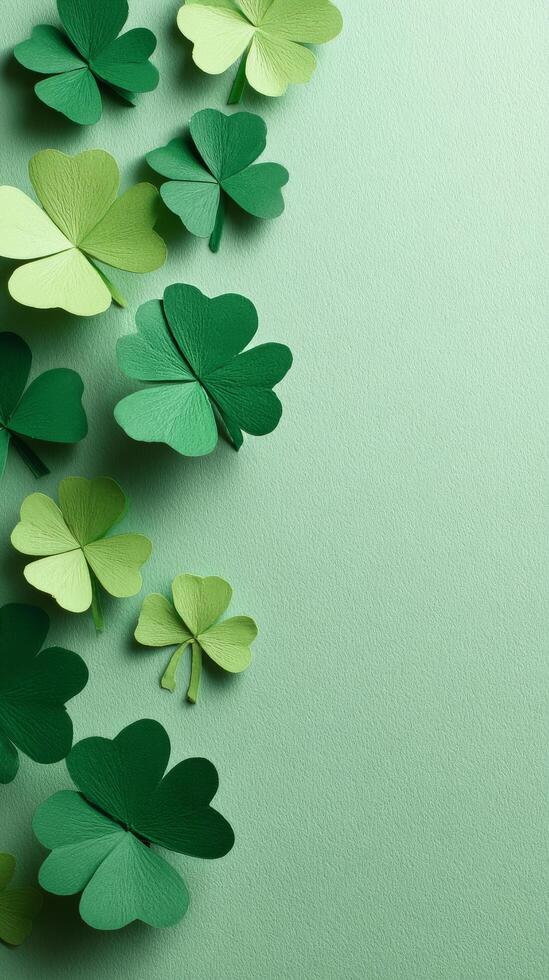 Green Paper Clovers Arranged on a Light Green Background for Decoration and Celebration photo