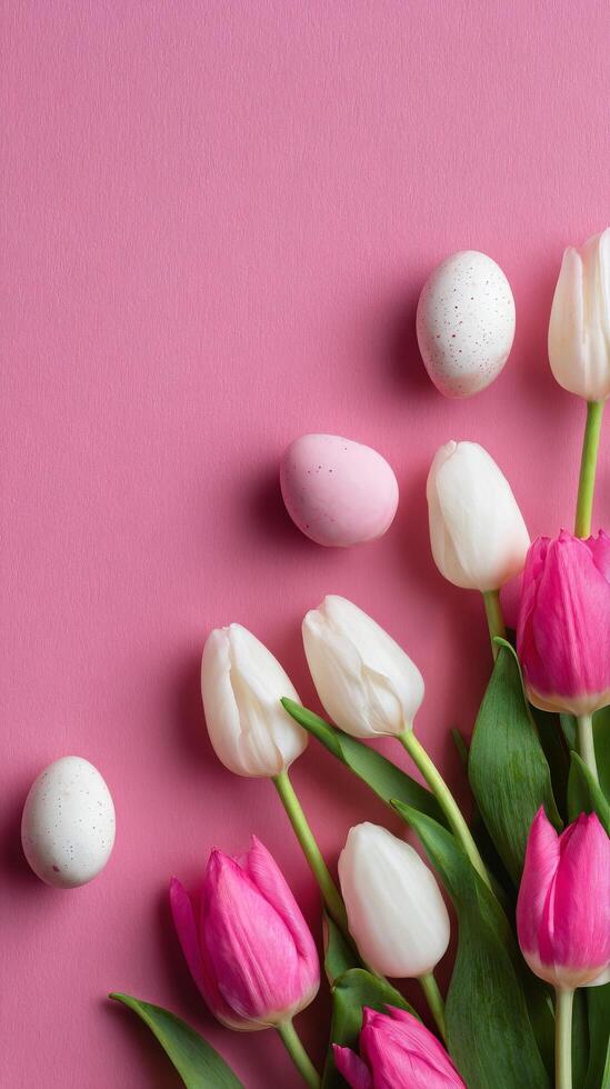 Spring Floral Arrangement With Tulips and Decorative Eggs on a Pink Background photo