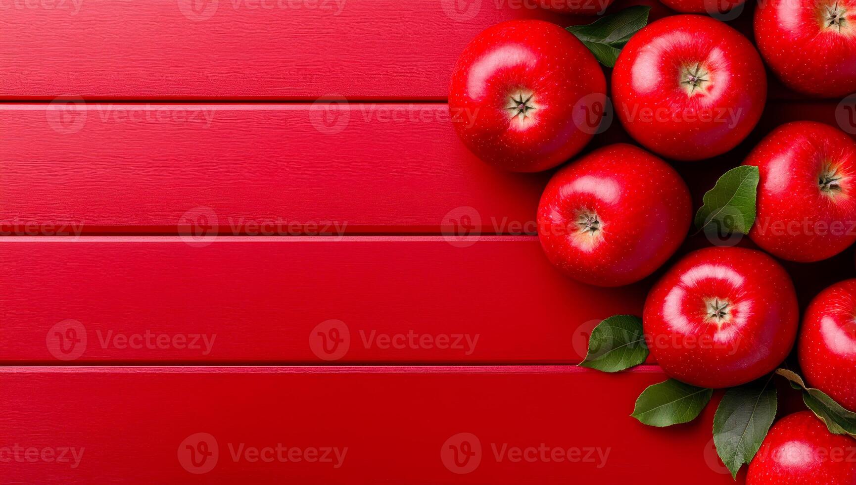 Glossy red apples on red. Fresh red apples are arranged artfully on a shiny red surface, showcasing their vibrant color and glossy texture. photo