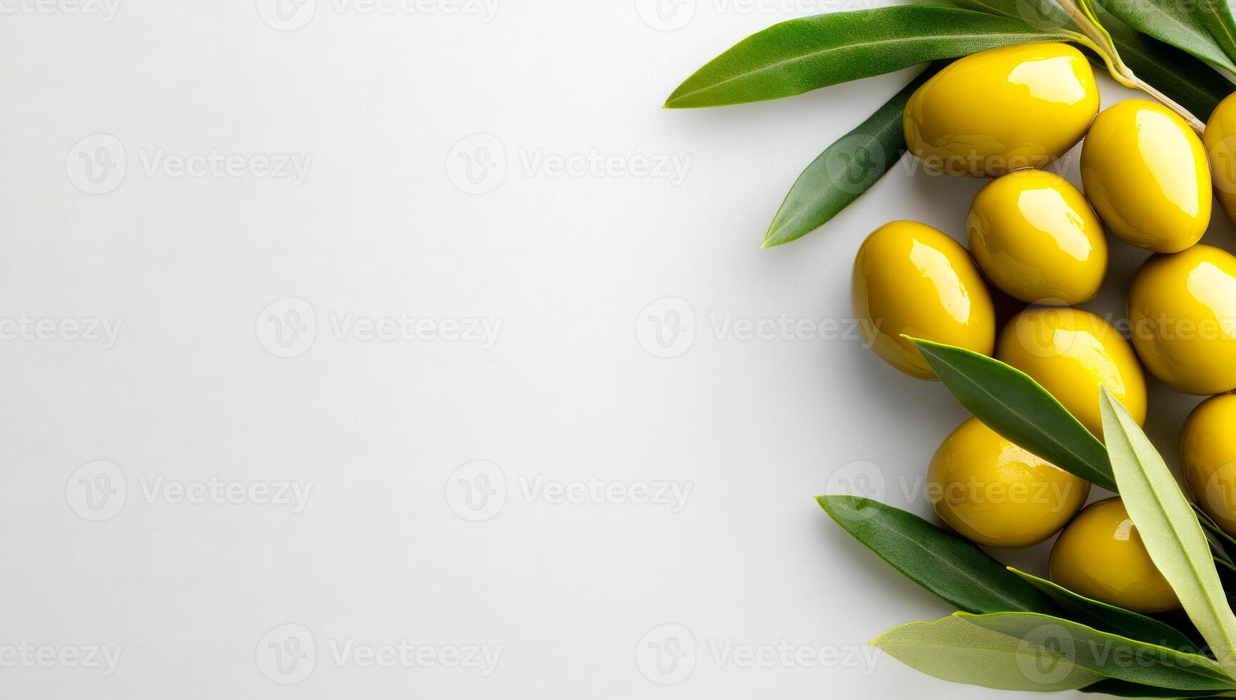 Green olives on white surface. Fresh green olives nestled among leaves, showcasing their vibrant color and natural shine in a simple arrangement. photo