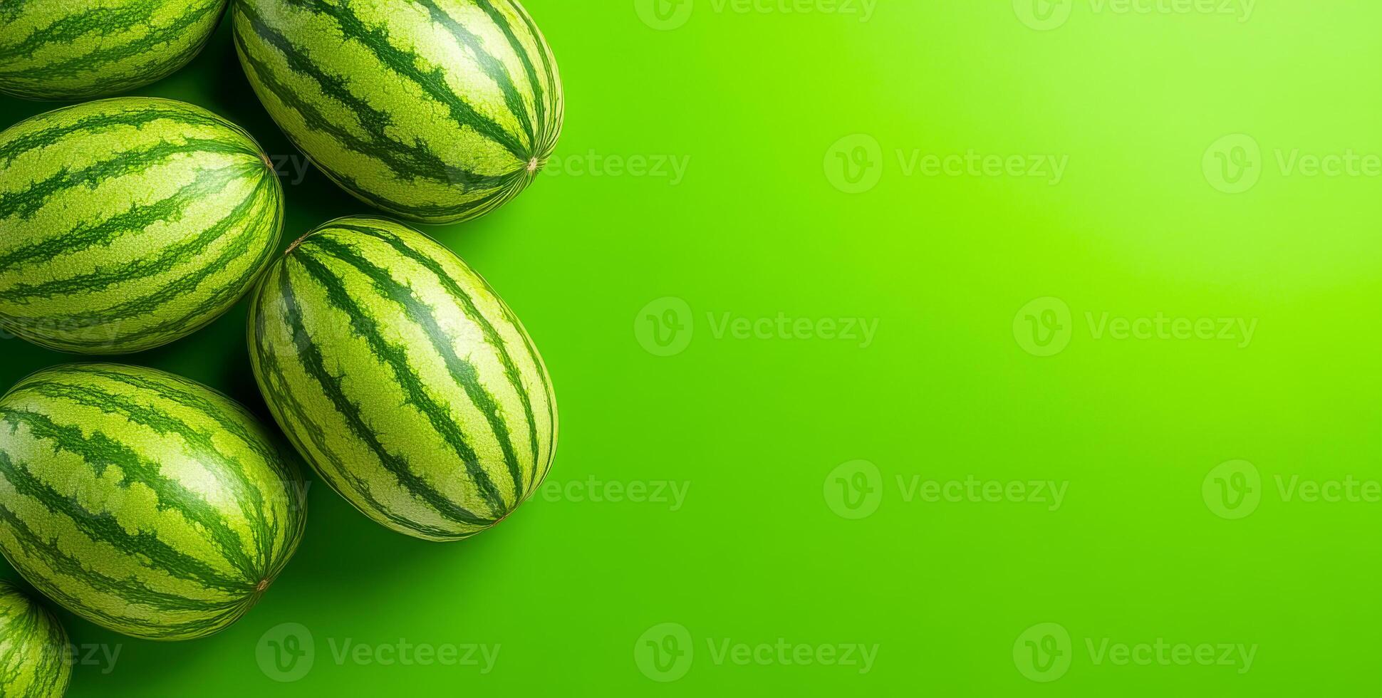 Fresh watermelons on green. Fresh striped watermelons sit on a green surface, highlighting their summer appeal in a delightful display. photo