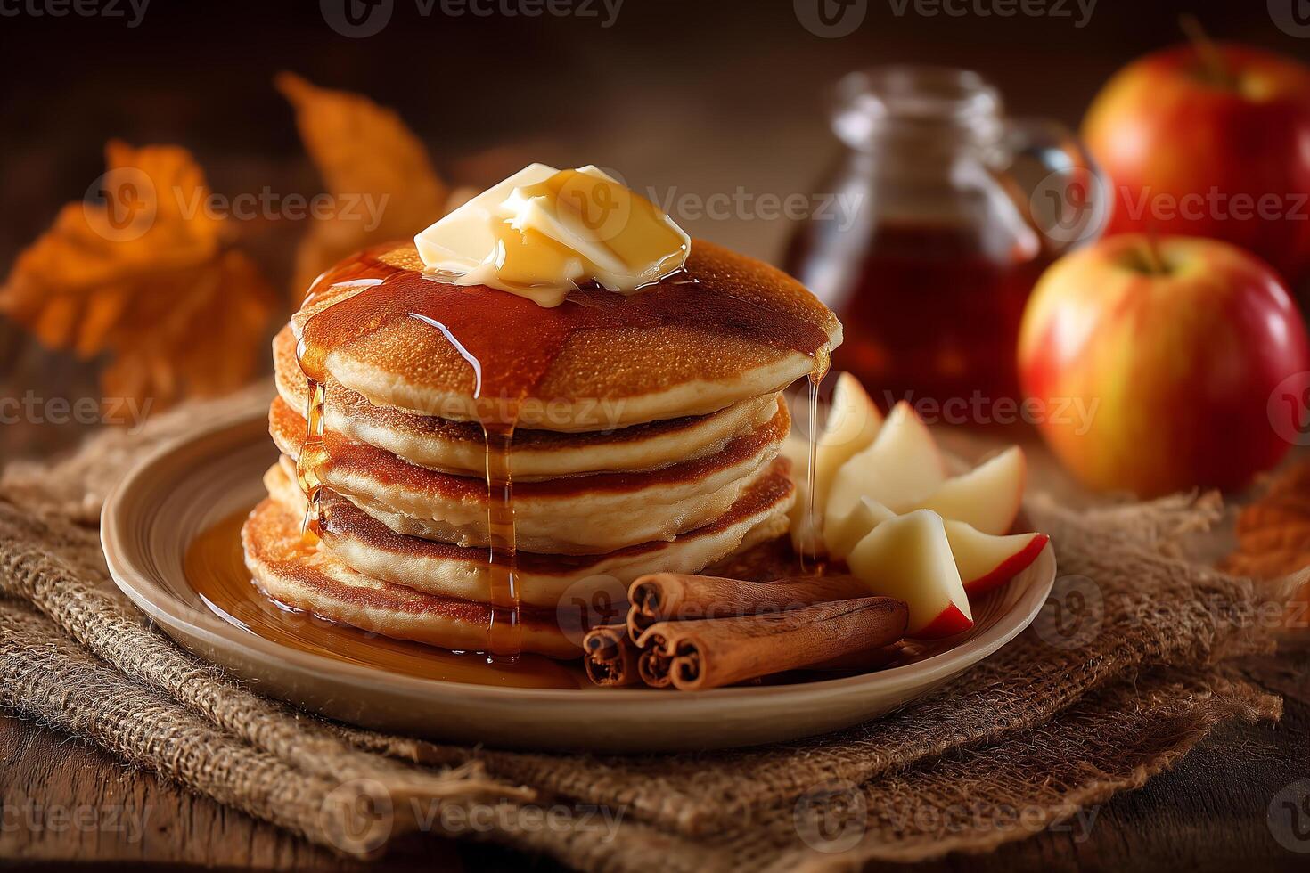 A plate of pancakes with apples and cinnamon photo