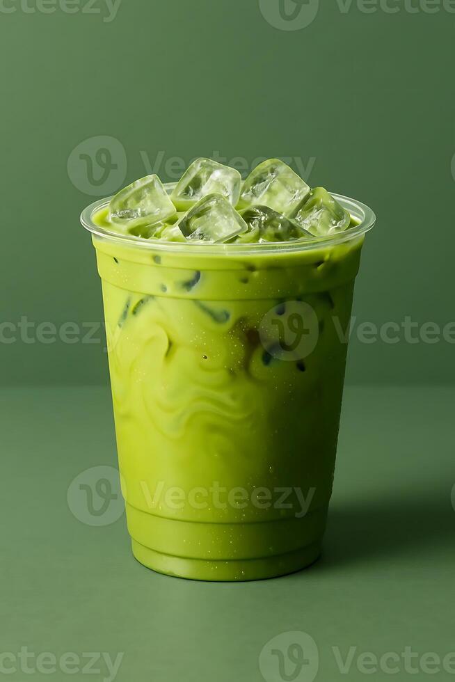 A green tea drink with ice cubes in it photo