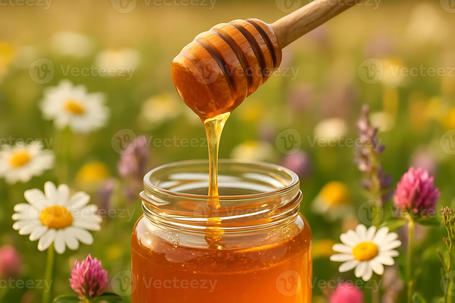 Honey in a jar with flowers photo