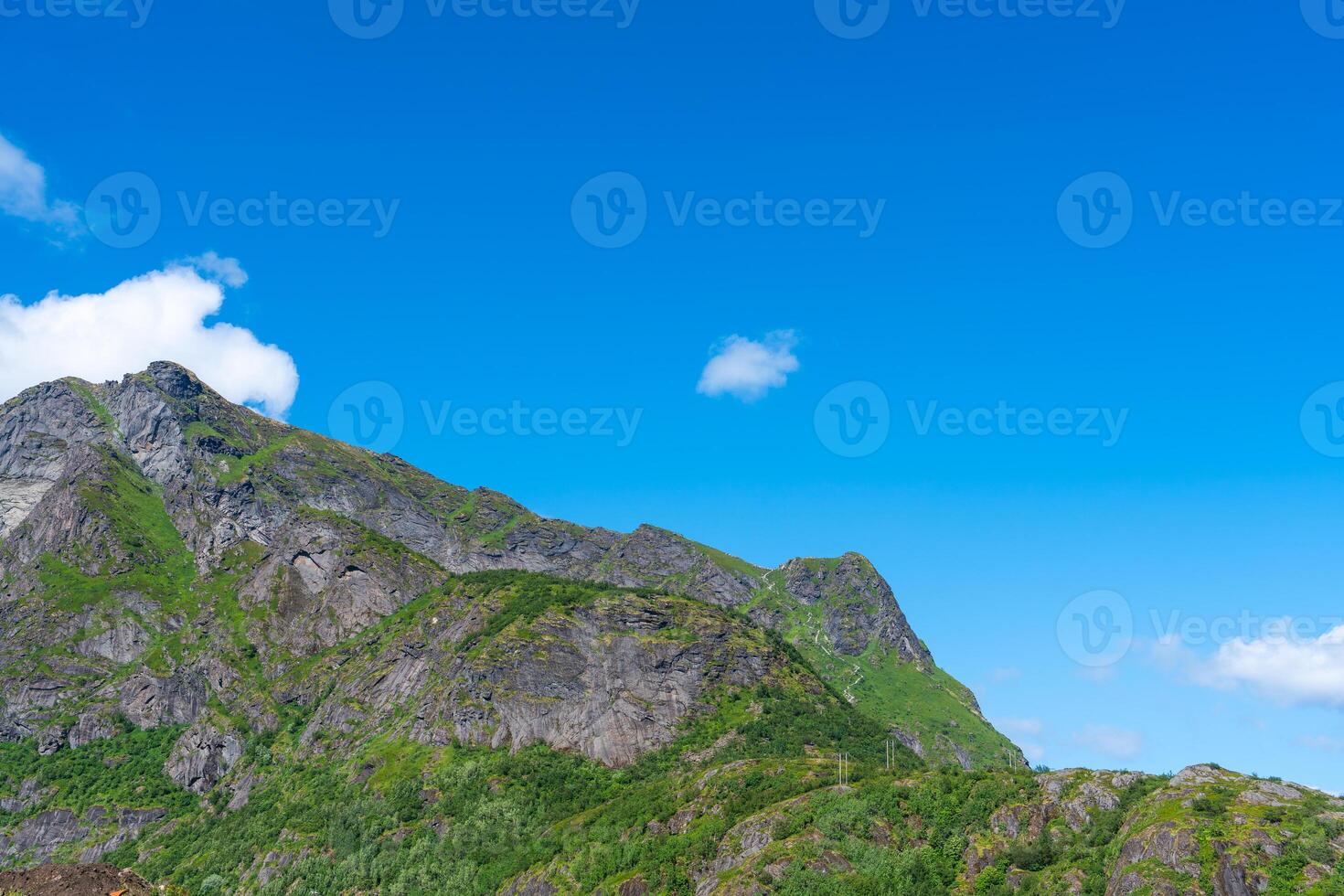 Summer sunny day at Lofoten, Norway, Nordland. Landscape with dramatic mountains and sea, ocean. fjord in the Lofoten Islands photo