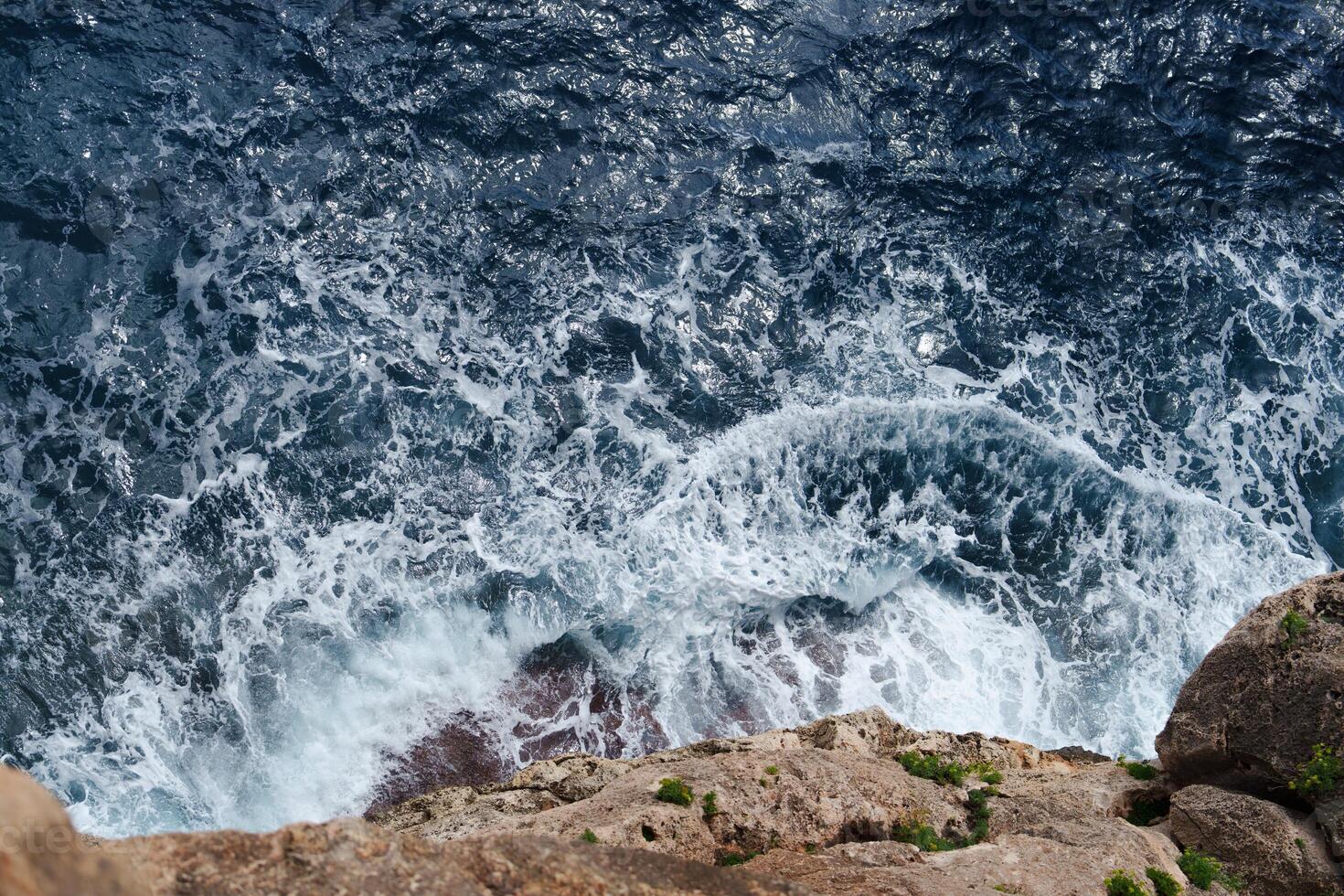 Majestic Ocean Waves Crashing Against Rocky Cliffs A Stunning Coastal Landscape View photo