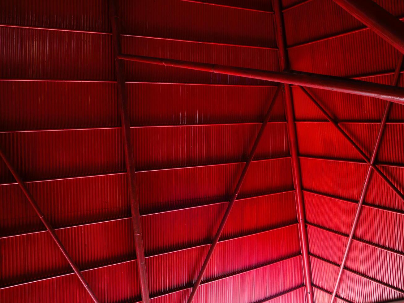 Rustic steel roof in red color, geometric background for aesthetic, modern, minimalist concept photo