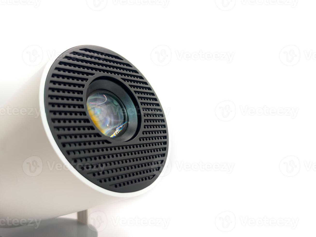 Clean projector lens macro close up view on white plastic body photo