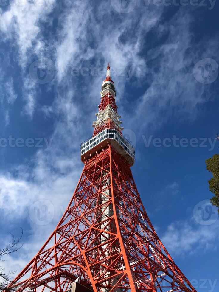 Tokyo Japan 01.01.2020 Tokyo Tower, iconic red and white landmark in Japan. A red and white tower with a red top. photo