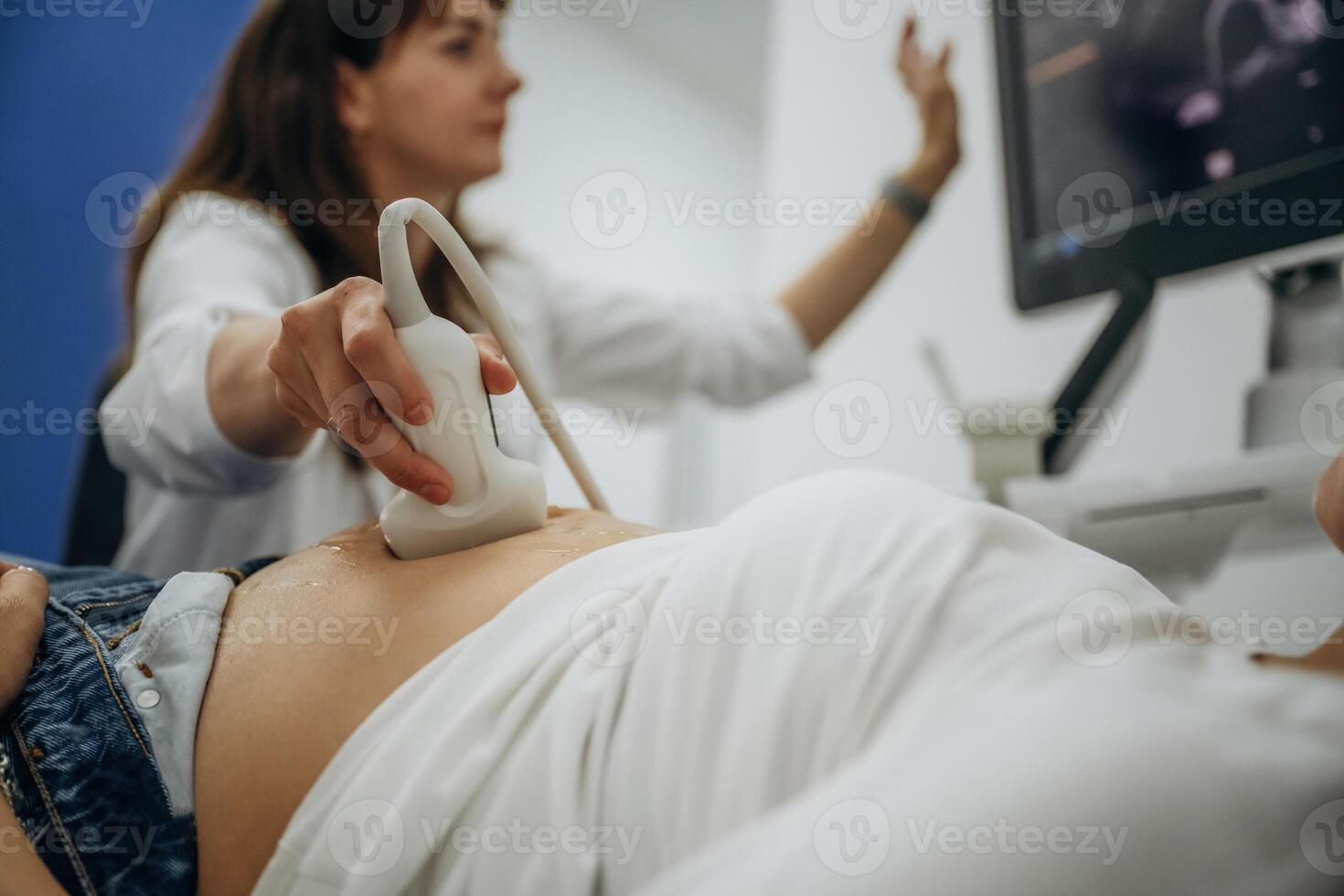 With big belly.., Pregnant woman undergoing ultrasound test photo