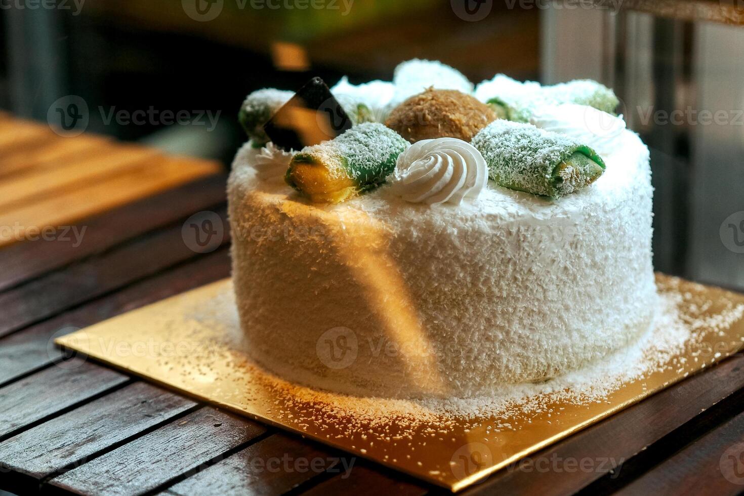 Cakes and pastries in shop, cafe, bakery fridge display for sale photo