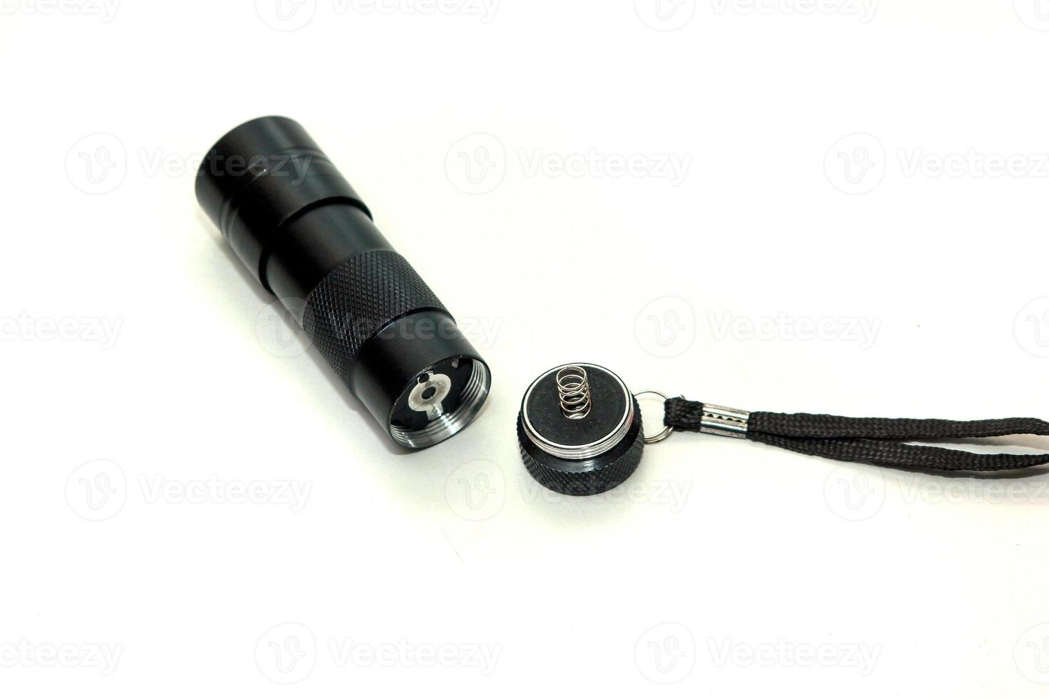 Flashlight components that have not been installed , isolated on white background, Disassembled flashlight components photo