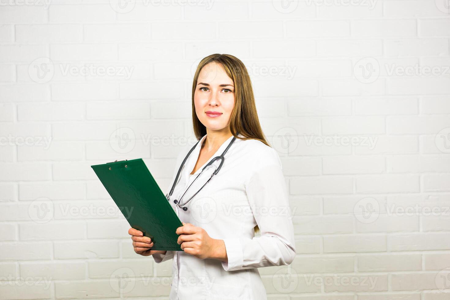 Smiling medical doctor woman with stethoscope photo