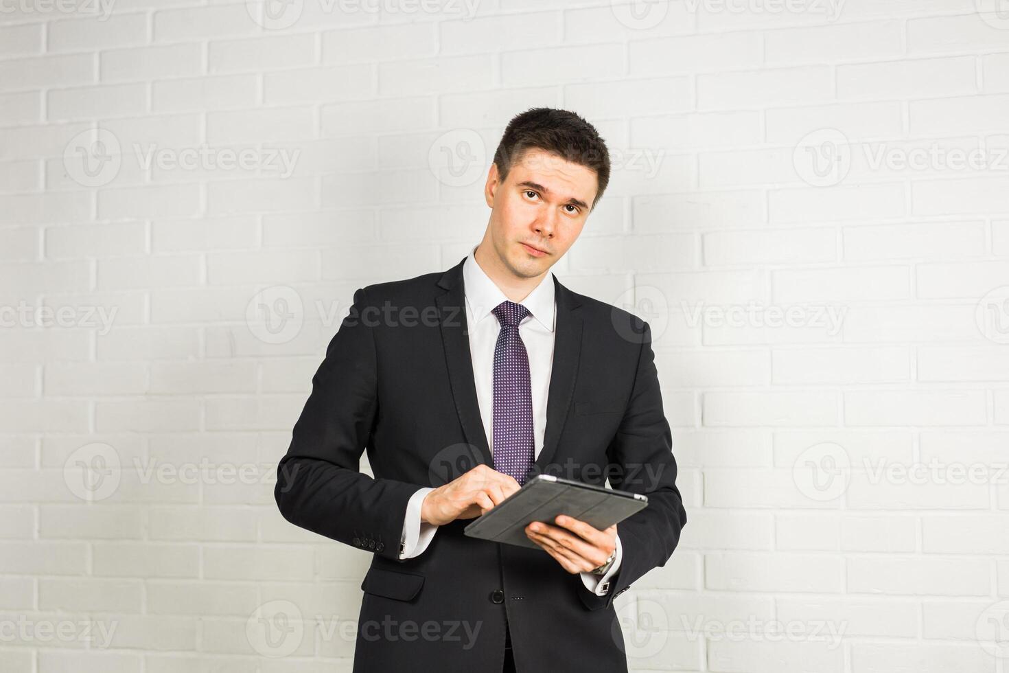 Businessman using a digital tablet photo
