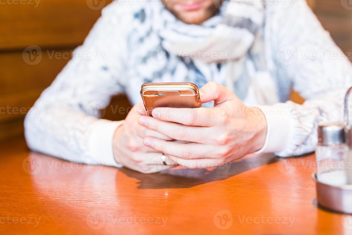 Close up of a man using mobile smart phone photo