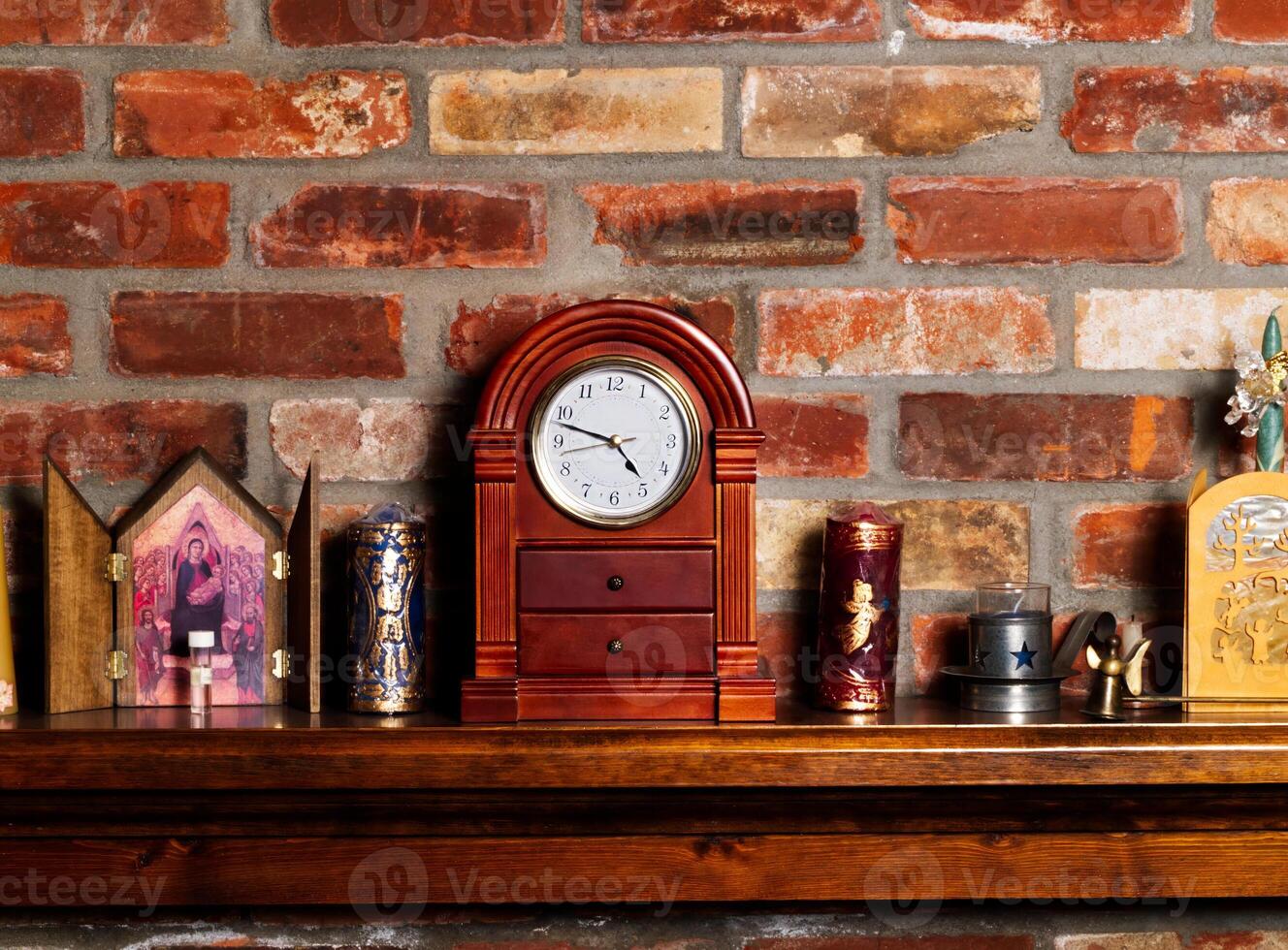 Fireplace Mantel With Clock And Christmas Candles photo