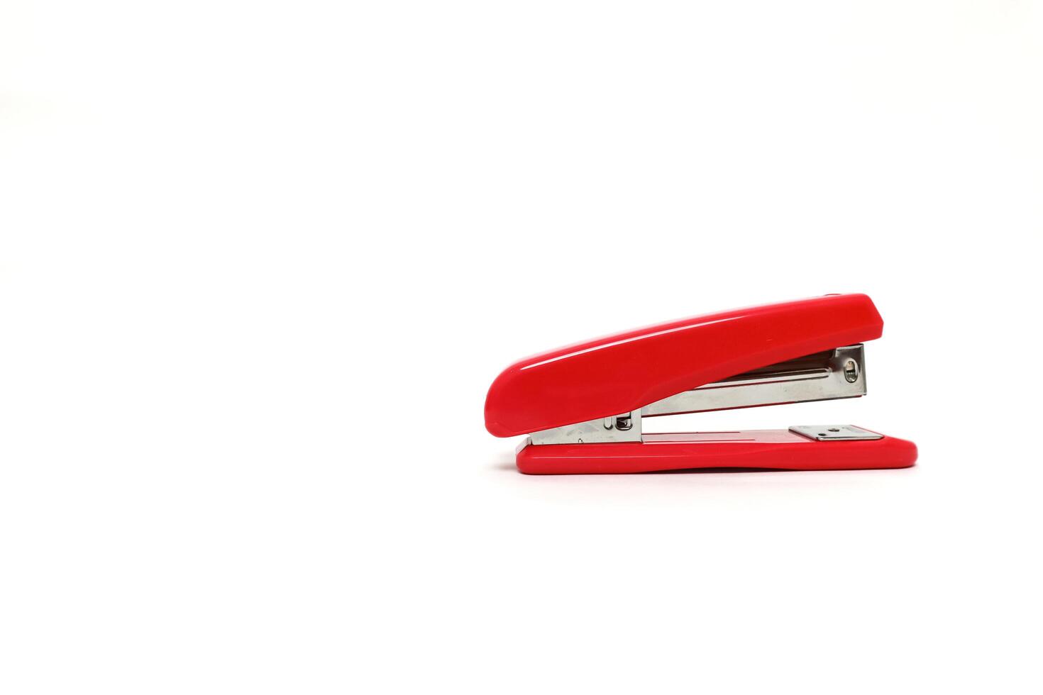 Vibrant Red Stapler on a Clean White Background, Ideal for Office and Stationery Concepts photo
