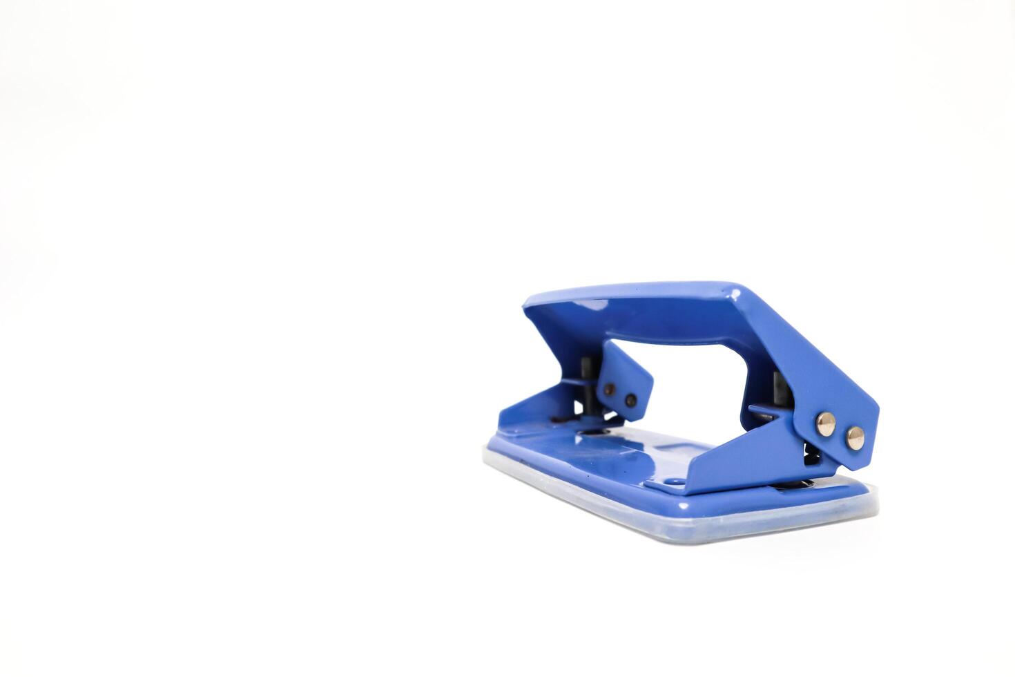 Blue two-hole paper punch stationery tool isolated on white surface, office equipment photo