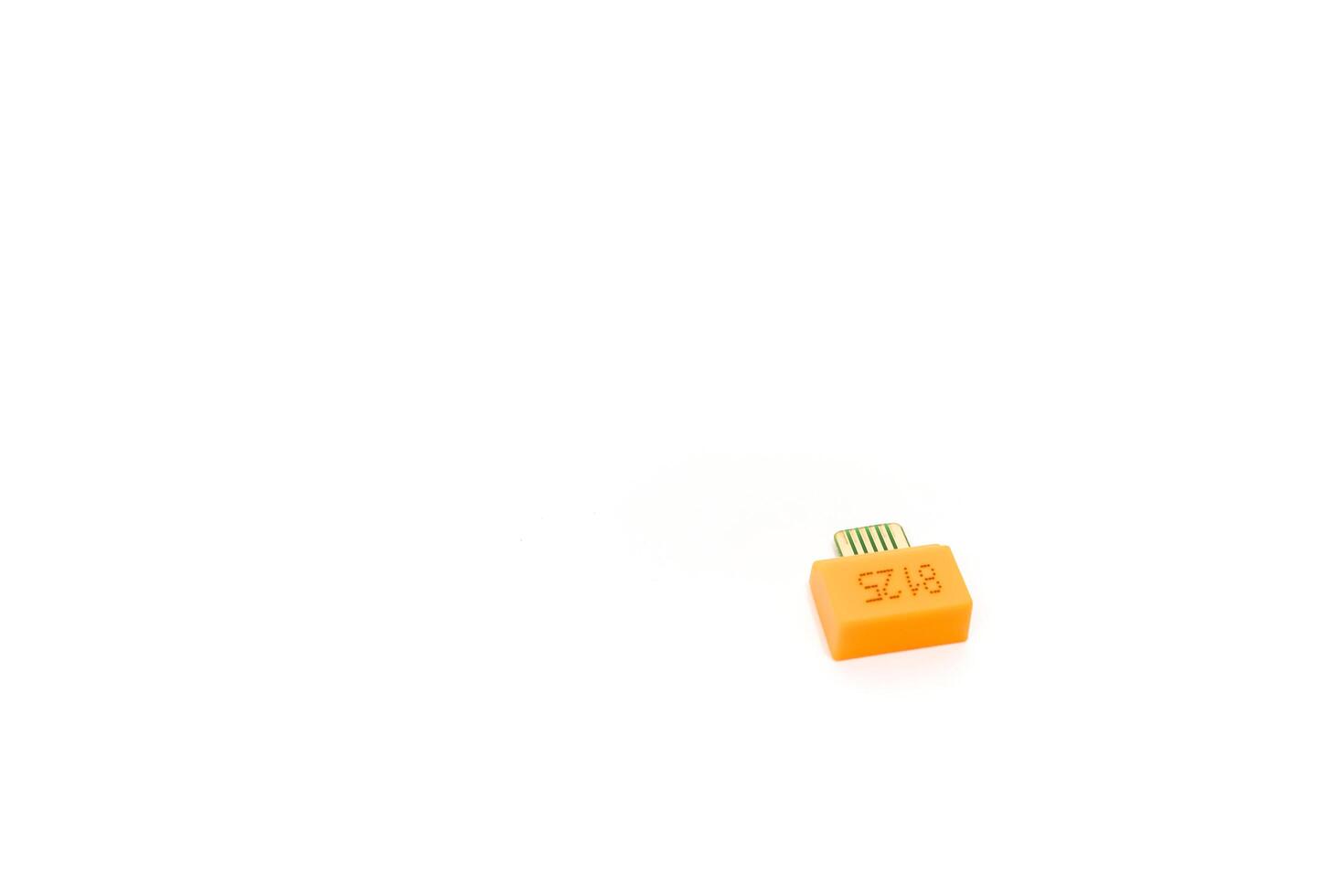 Close-up of a blood glucose meter test strip used for diabetes management photo