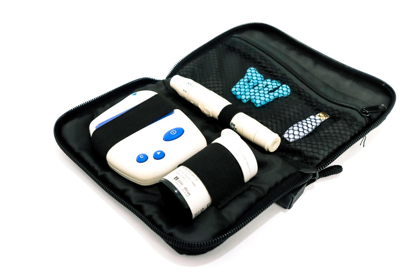 Portable diabetes management kit showcasing glucometer, test strips, and lancing device within a compact black carrying case photo