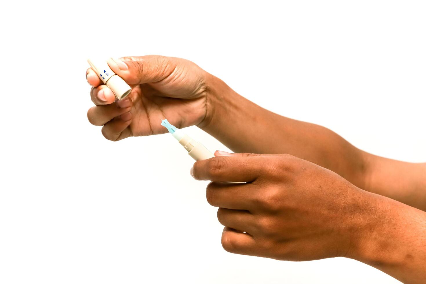 Hands Assembling Glucose Meter Components for Diabetes Monitoring photo