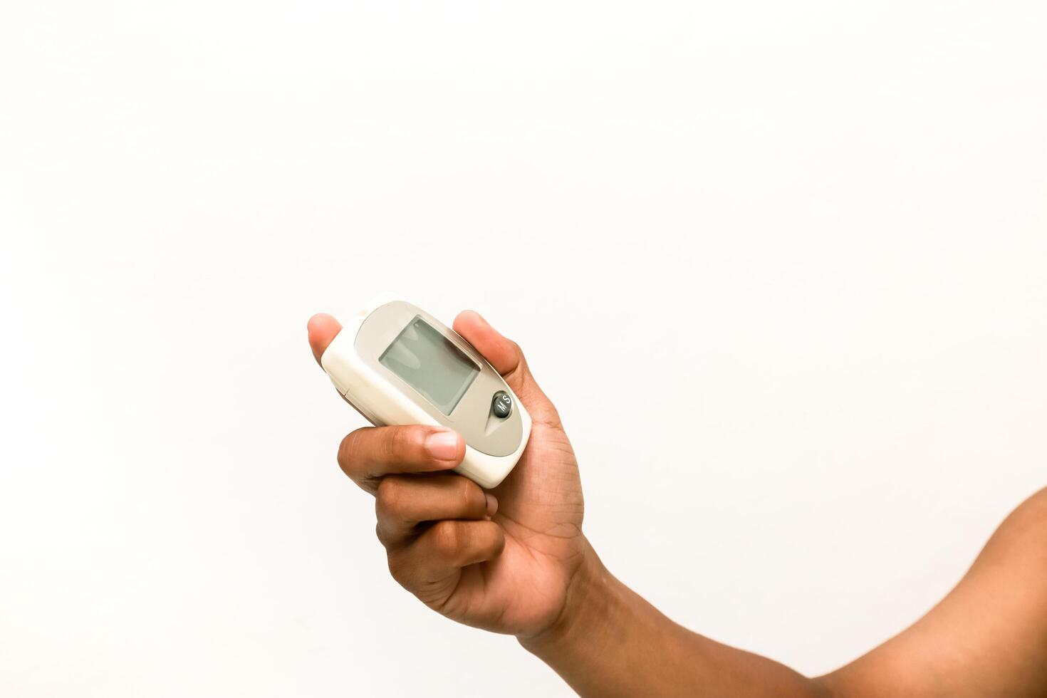 Hand holding pulse oximeter for measuring oxygen saturation levels at home photo