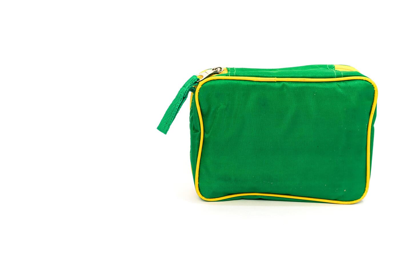 Isolated green cosmetic bag with yellow border on a clean white background, perfect for travel photo