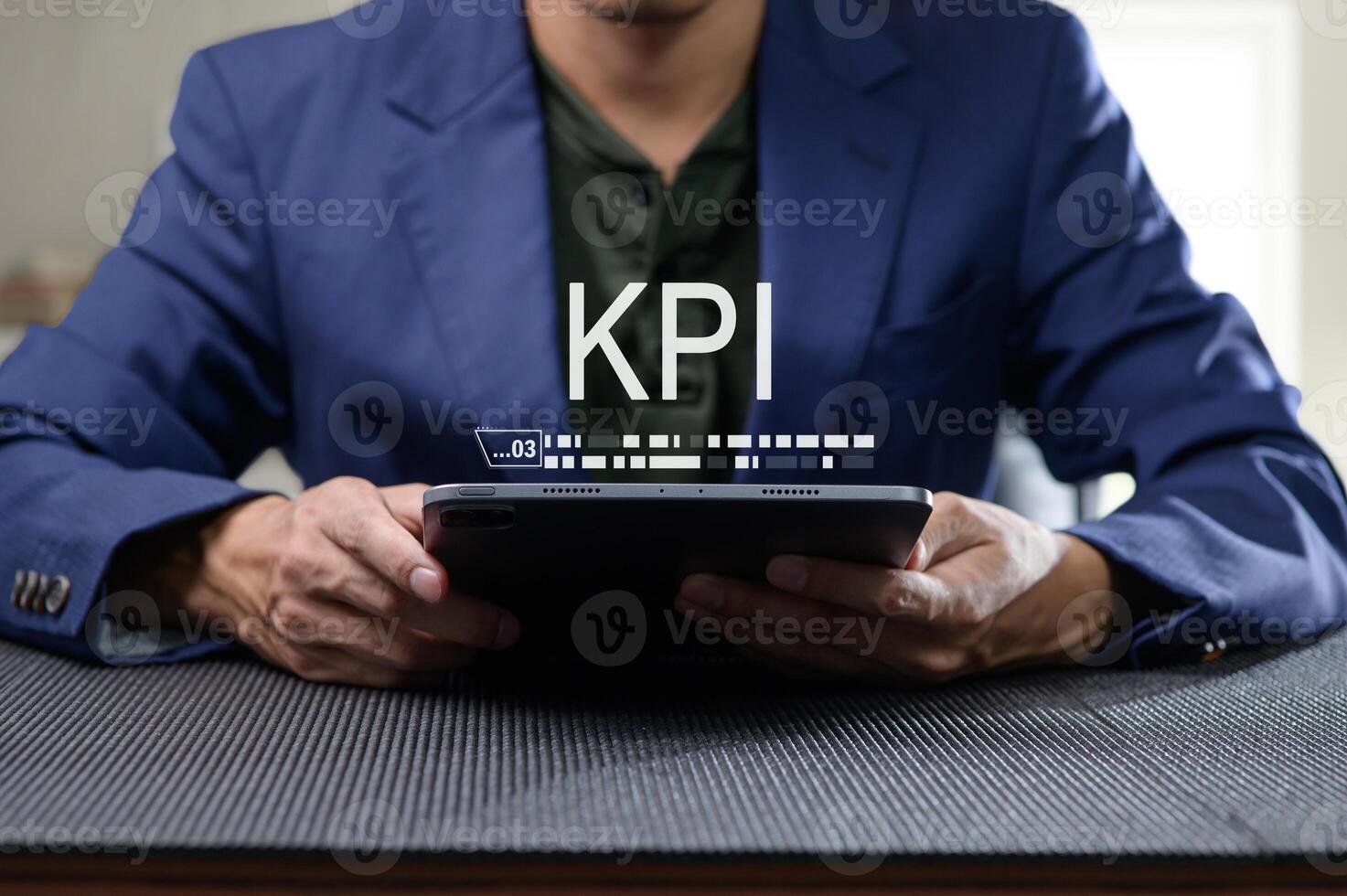 Professional Man Evaluating KPI Performance Indicators on Tablet photo