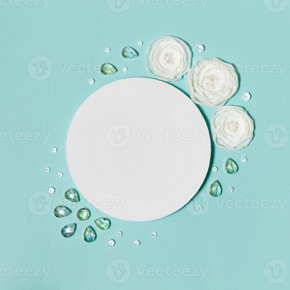 Mint Square Background With Ranunculus Flowers and Crystals and Empty Place for Text photo