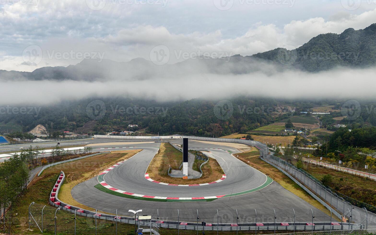 View of racetrack asphalt with curve of motor racing circuit in valley photo