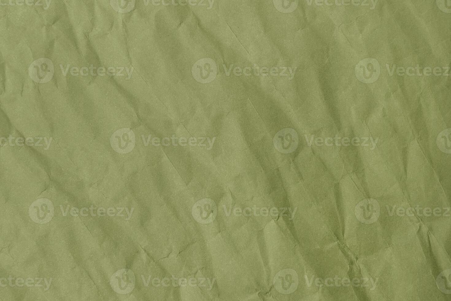 Abstract green wrinkled crumpled paper texture background photo