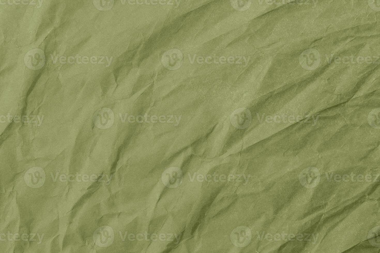 Abstract wrinkled green crumpled paper texture background photo