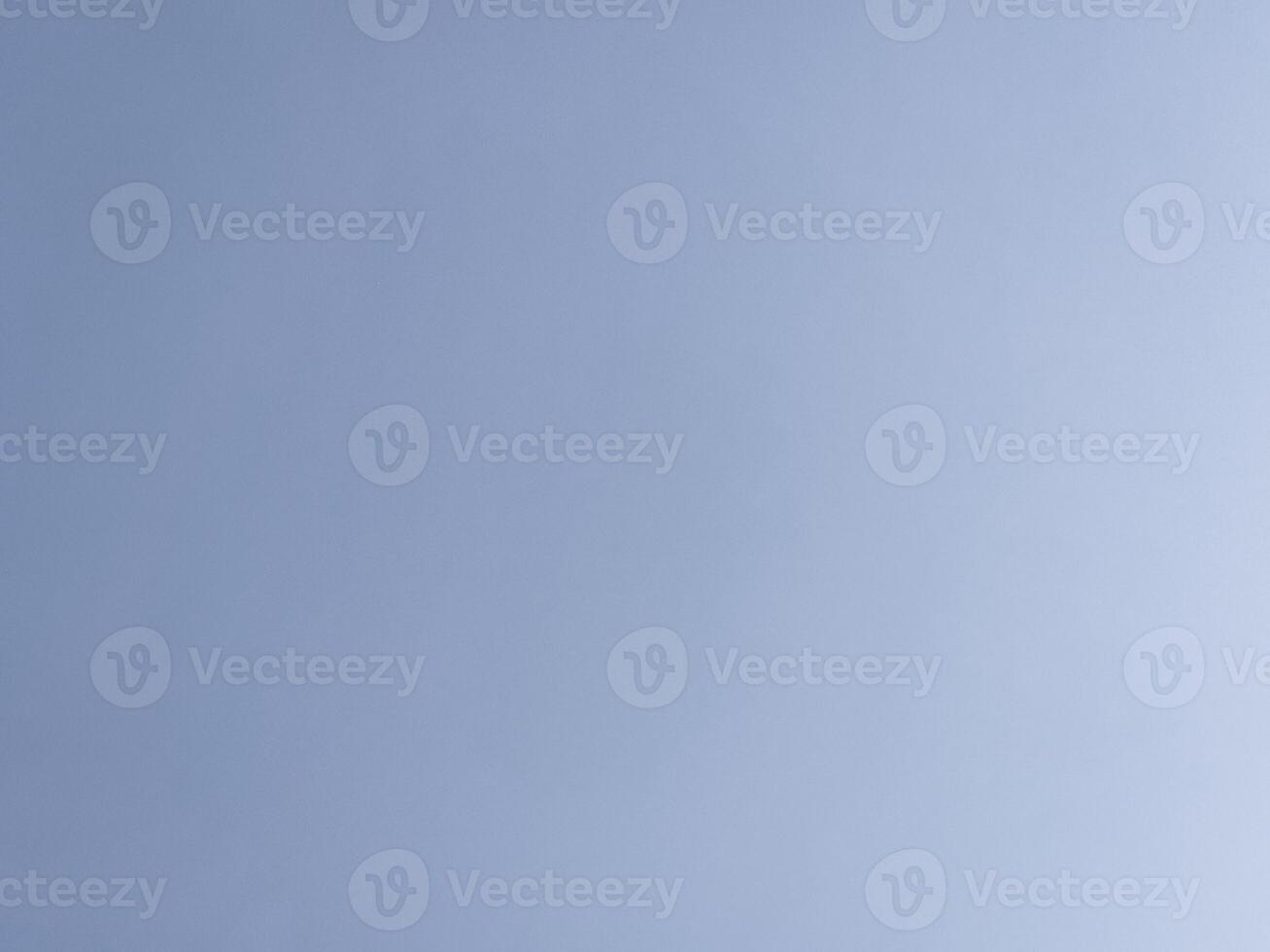 Clear Blue Sky A clear blue sky with minimal clouds, evoking a sense of calm and openness. photo