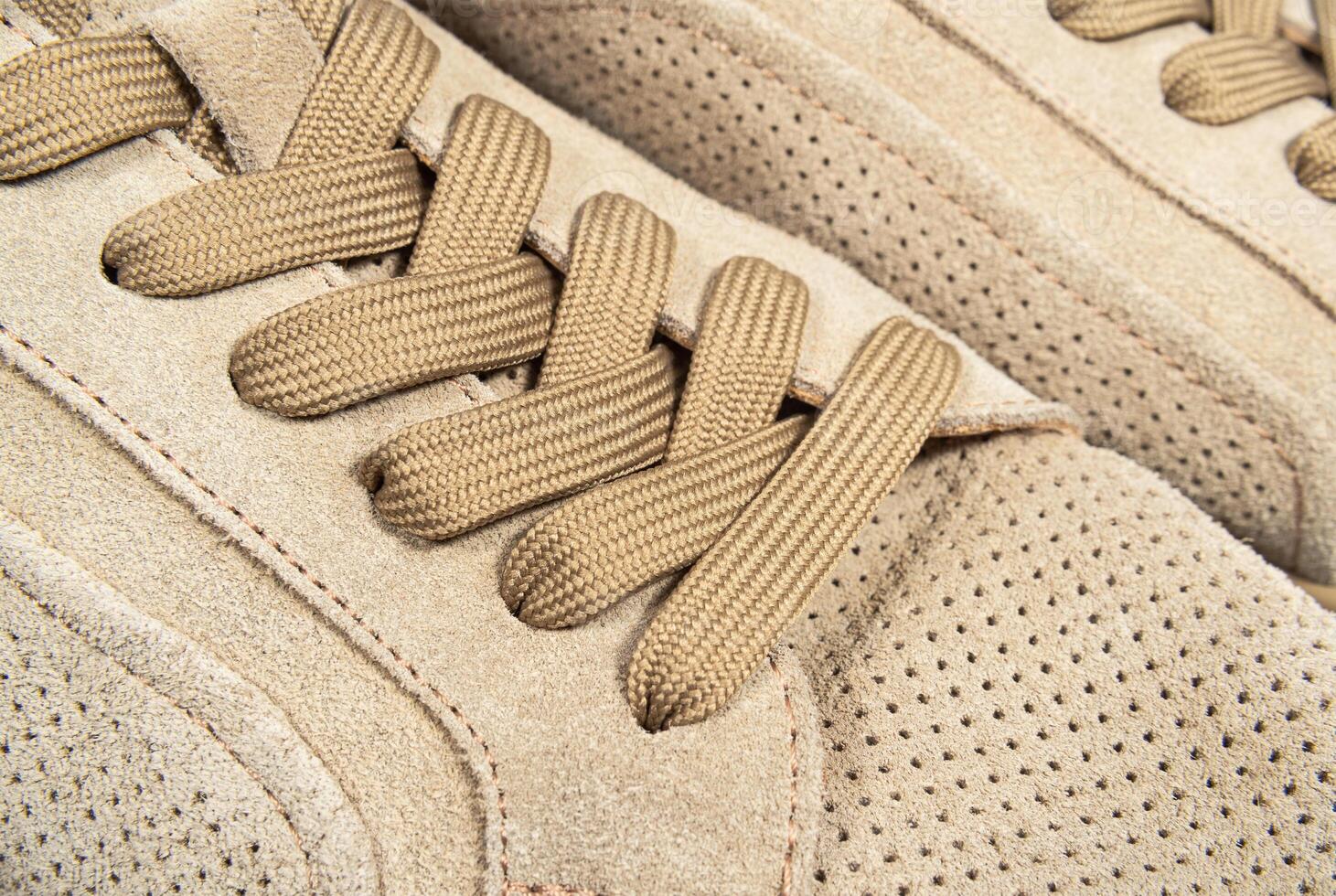 Brown suede lace-up shoes close-up photo