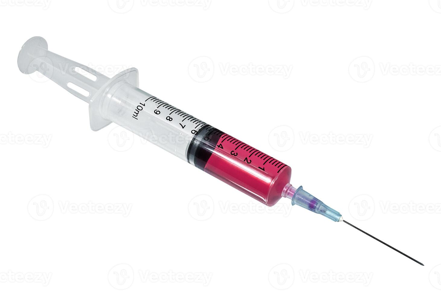 Syringe with red vaccine closeup on the white background photo