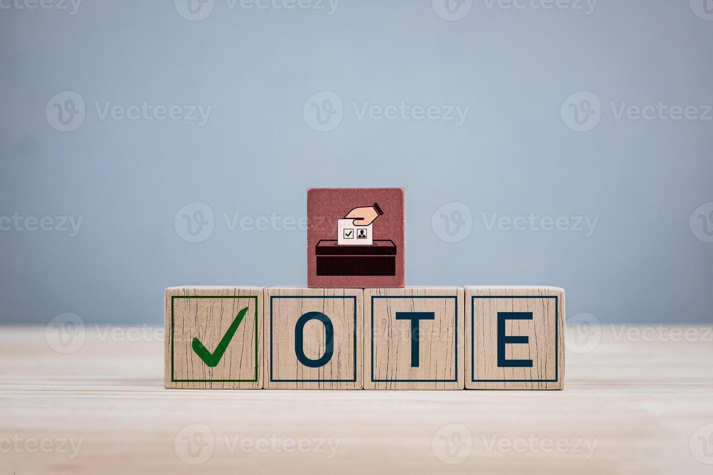 Wooden block with the letters VOTE and a check mark. Concept of election, political election campaign, voting and democratic rights exercise system photo