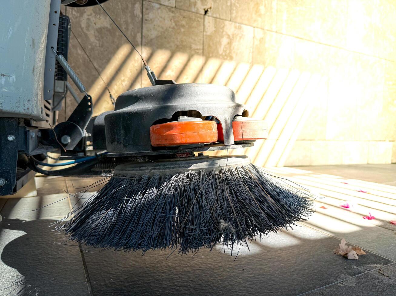 Circular nylon brush of a special street sweeper vehicle photo