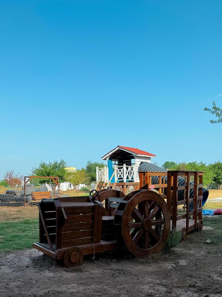 childrens playground made of wood in eco style photo