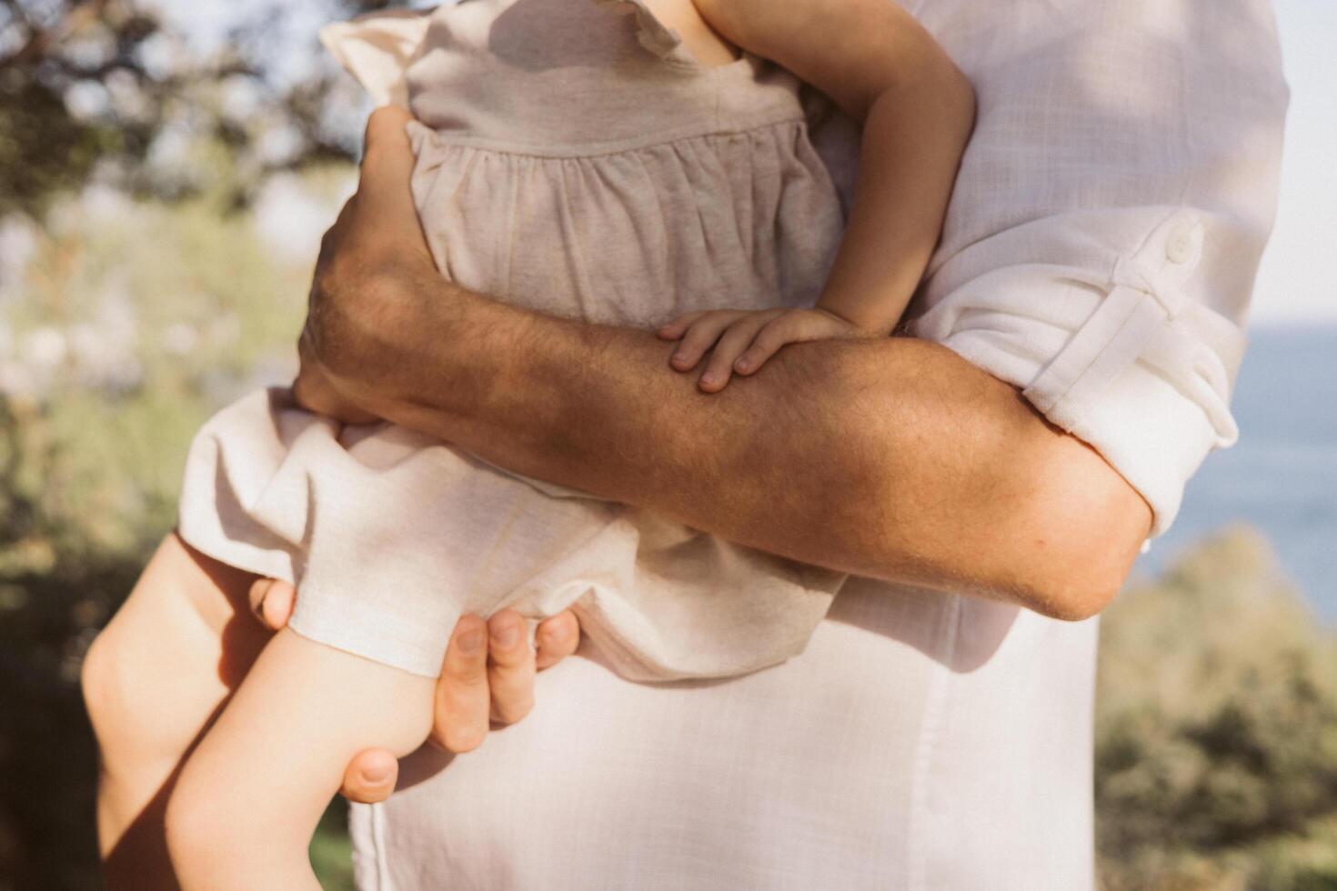 close up baby girl with father photo