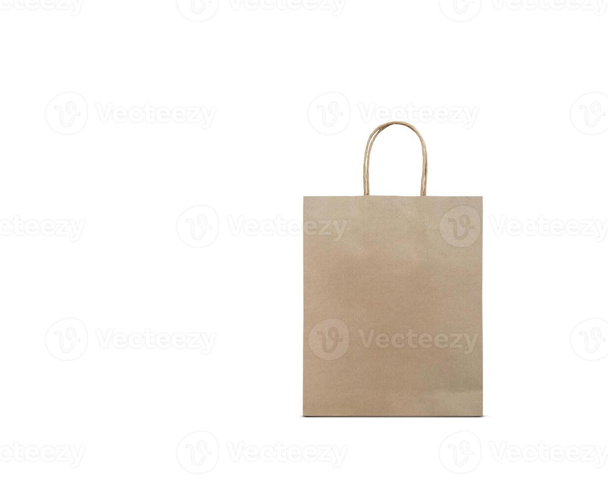 Blank brown kraft paper bag on white background. Eco-friendly shopping bag made of recycled paper. Template with copy space. photo
