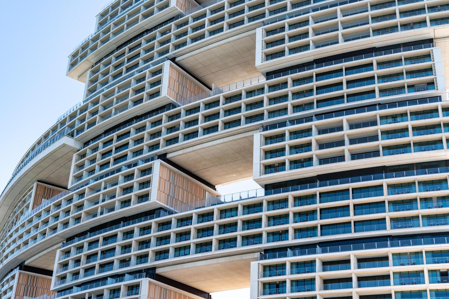 Dubai, United Arab Emirates - March 17, 2023-particular of the architecture of the hotel Atlantis The Royal at Palm Jumeirah during a sunny day photo