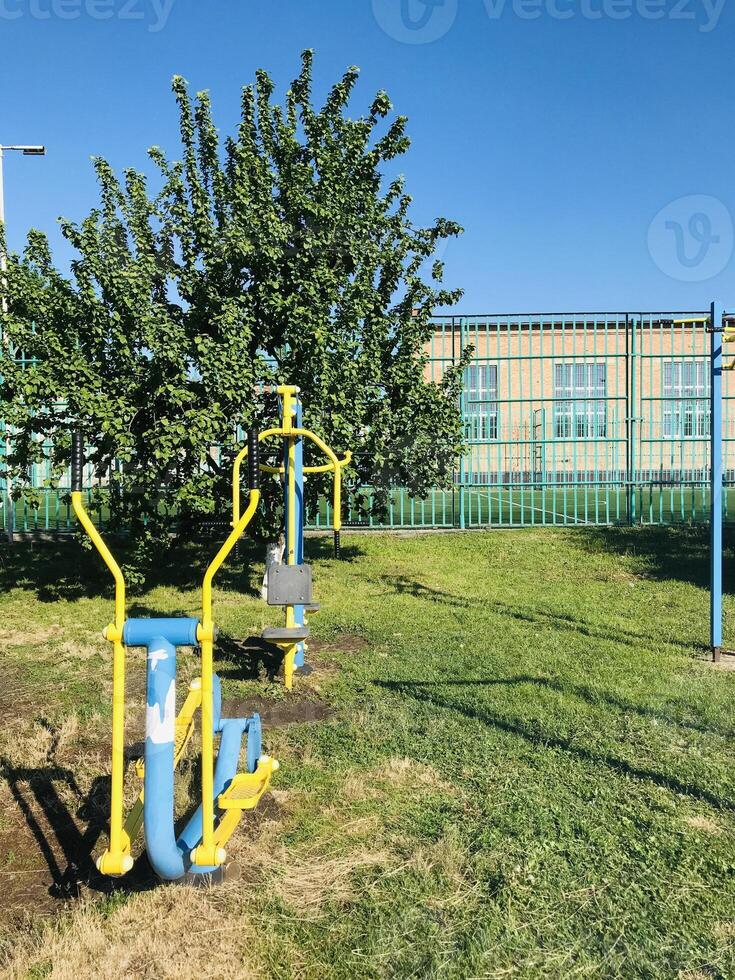 Exercise equipment for individuals with special needs in public park.. photo