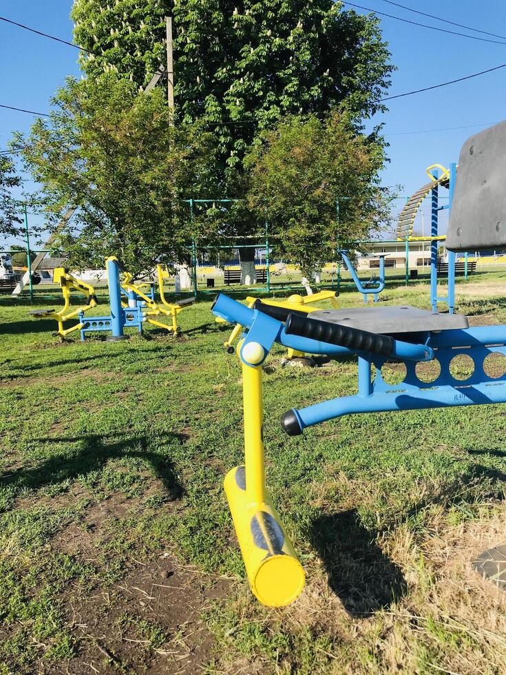 Exercise equipment for individuals with special needs in a park, photo