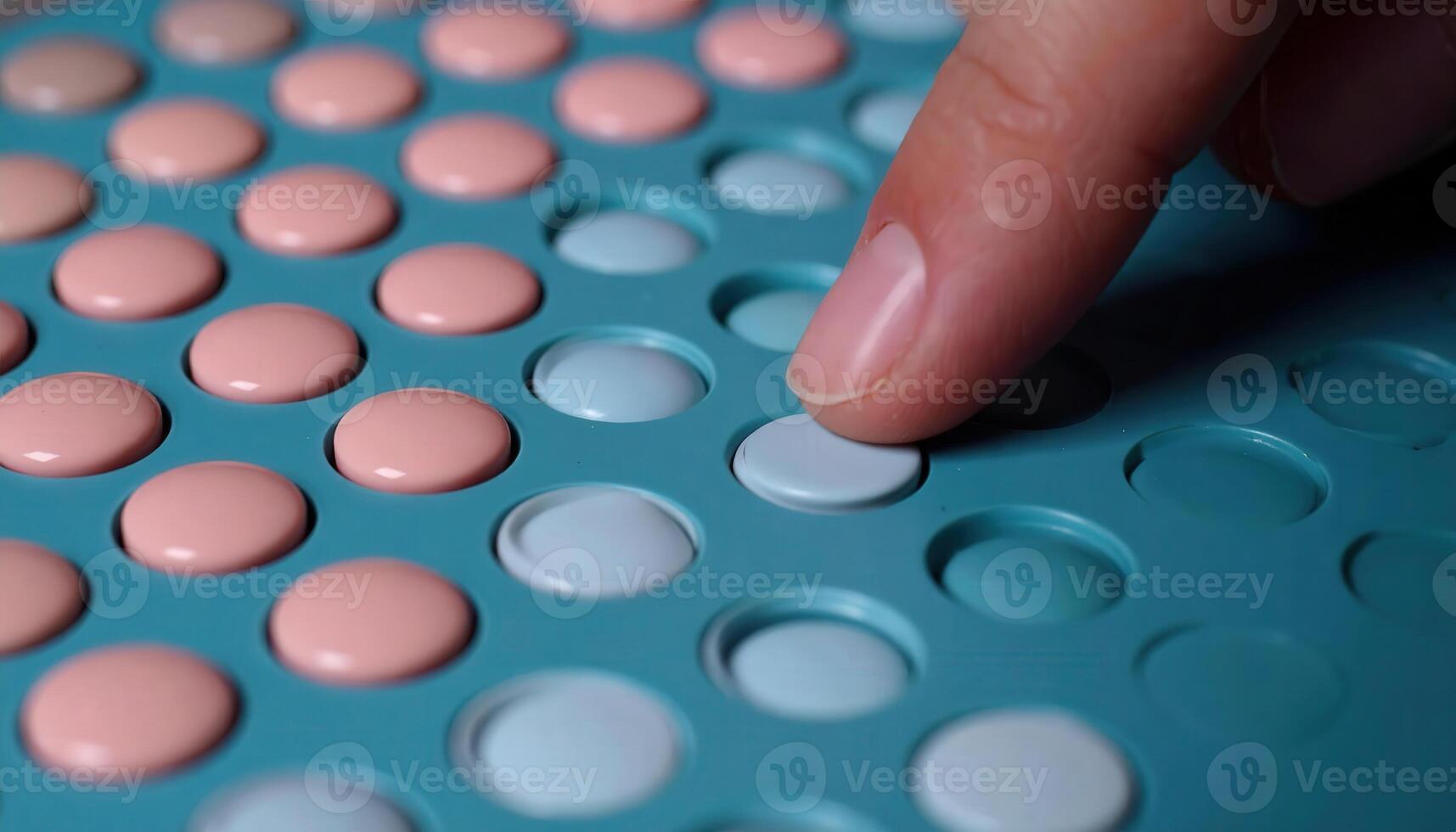 Close-Up of Hand Adjusting Colorful Dots on a Marker Board for Beauty Tech photo
